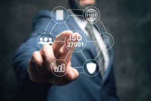 ISO-27018-Consultancy-&-Maintenance A cybersecurity consultant explaining ISO 27018 data privacy policies to a corporate team using visual charts and cloud-based diagrams